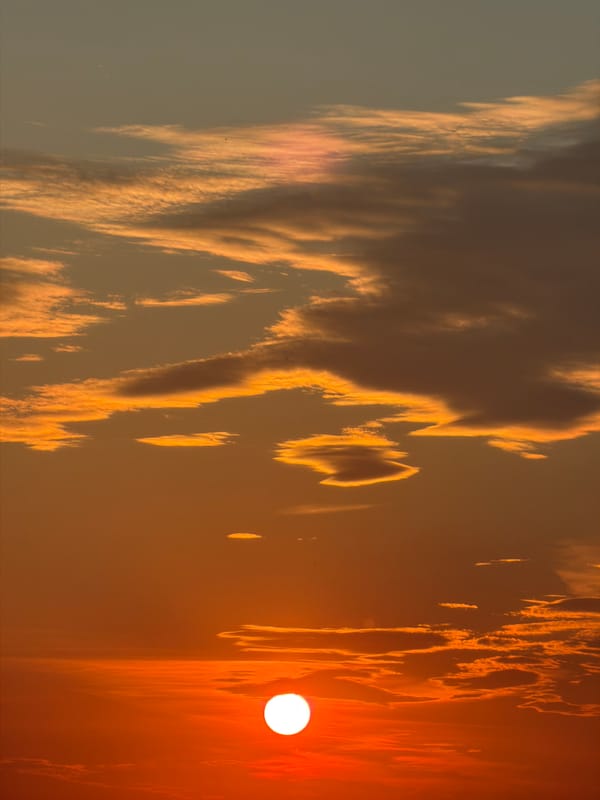 Dramatic sunset with orange clouds captured by witnesses