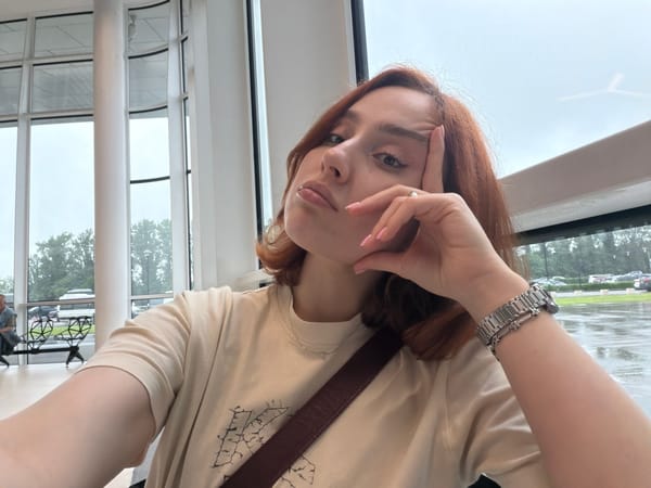 Red-haired traveler documented at Kutaisi International Airport, Georgia