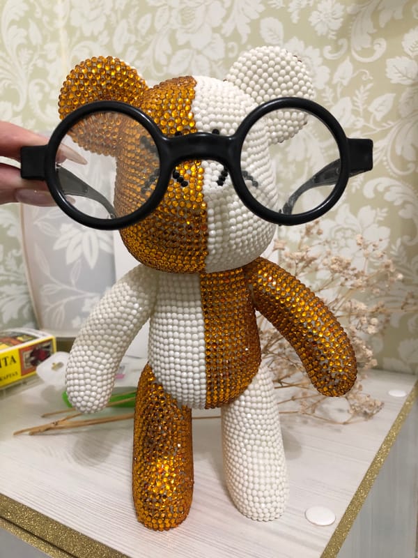 Woman poses with novelty eyeball glasses in Noviy, Russia