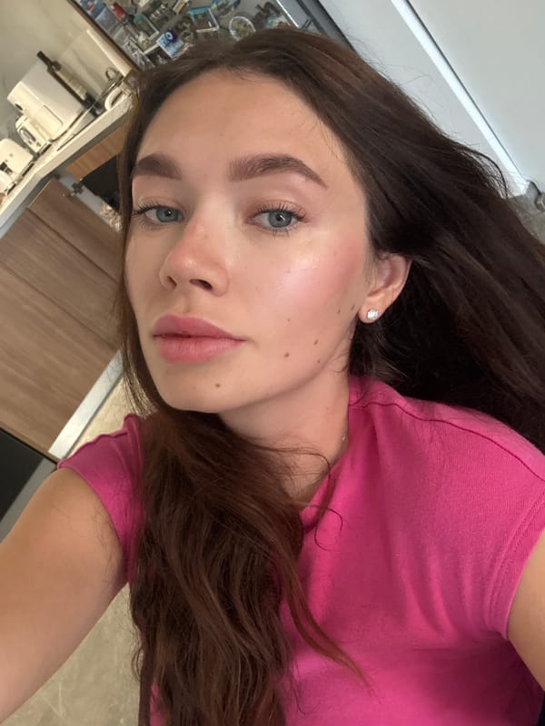 Woman takes selfie in pink shirt, Cyprus
