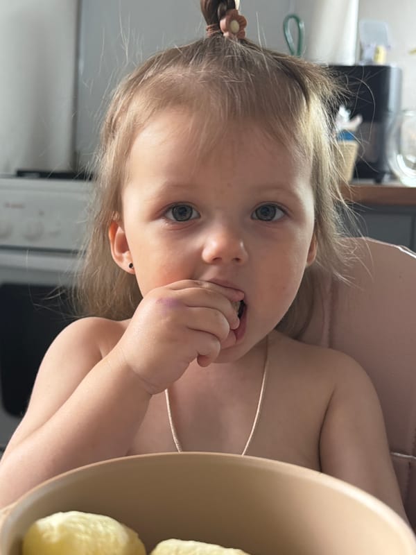 Toddler observed eating at table in Reshetnikovo, Russia