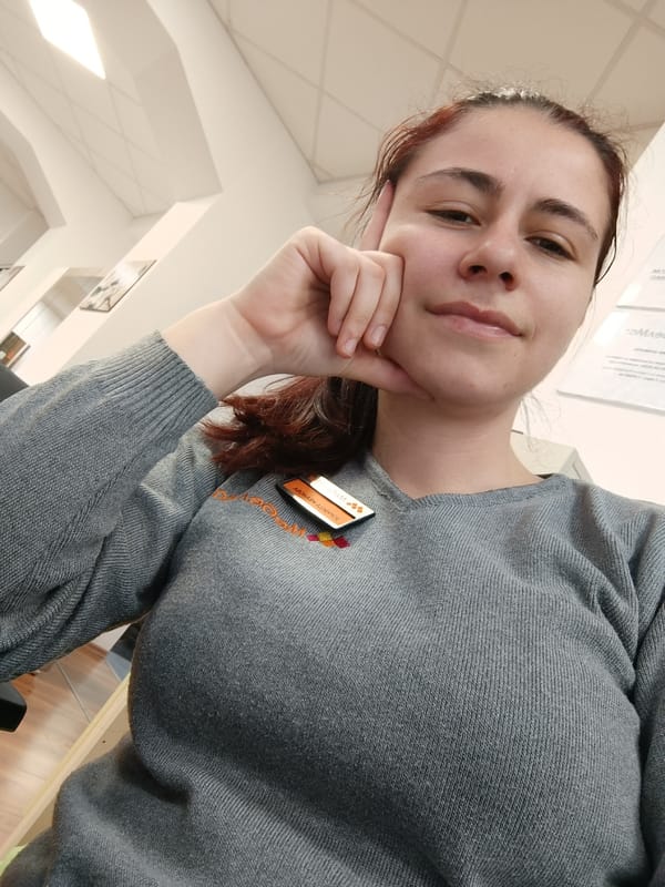 Woman takes selfie in Sofia office environment
