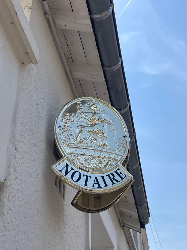Notaire sign and civic monument spotted in Meaux, France