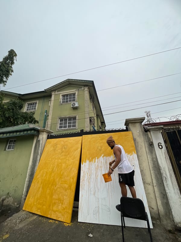 Street artist paints figure portraits outdoors in Ado, Nigeria