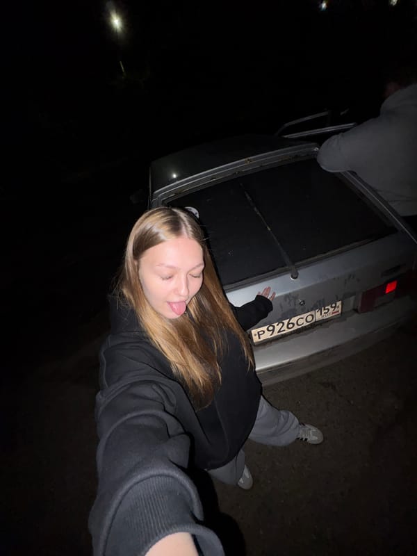 Young couple photographed with car during nighttime encounter in Chaikovsky