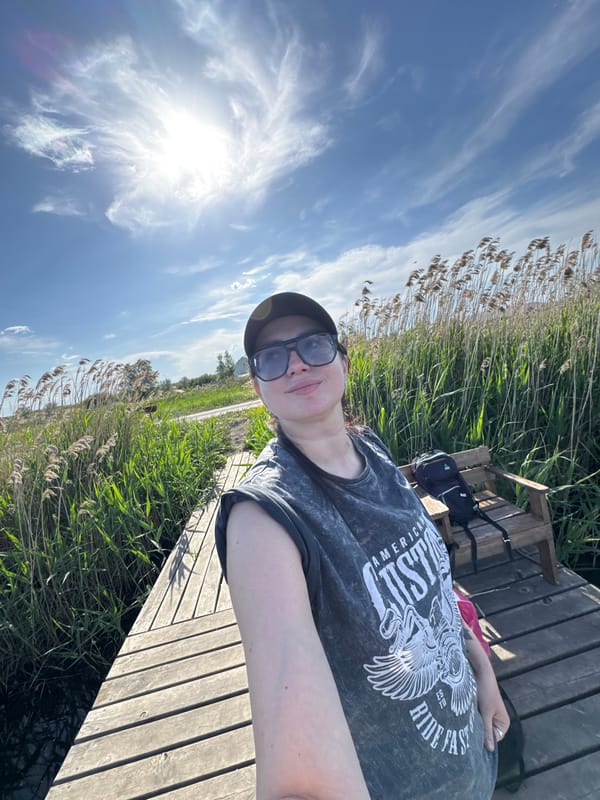 Couple enjoys fishing and selfies on sunny dock afternoon