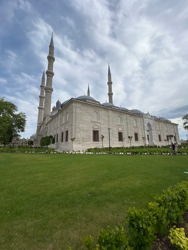Visitor photographs historic Selimiye Mosque in Edirne, Turkey