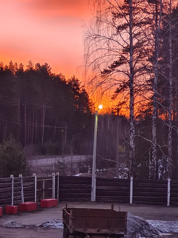 Sunset documented in Noviy, Russia with truck present