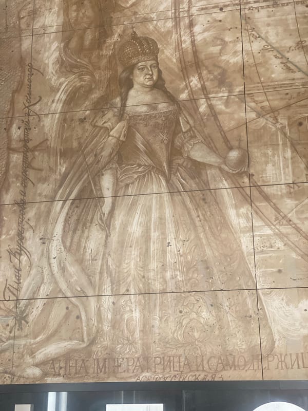 Moscow wall mural shows crowned woman with globe