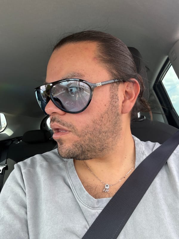 Man photographs himself in car in Mexico neighborhood