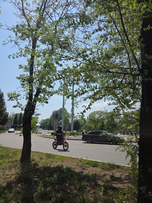Morning street life and flags observed in Birobidzhan