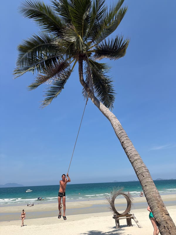 Beach morning with rope swings and colorful attractions