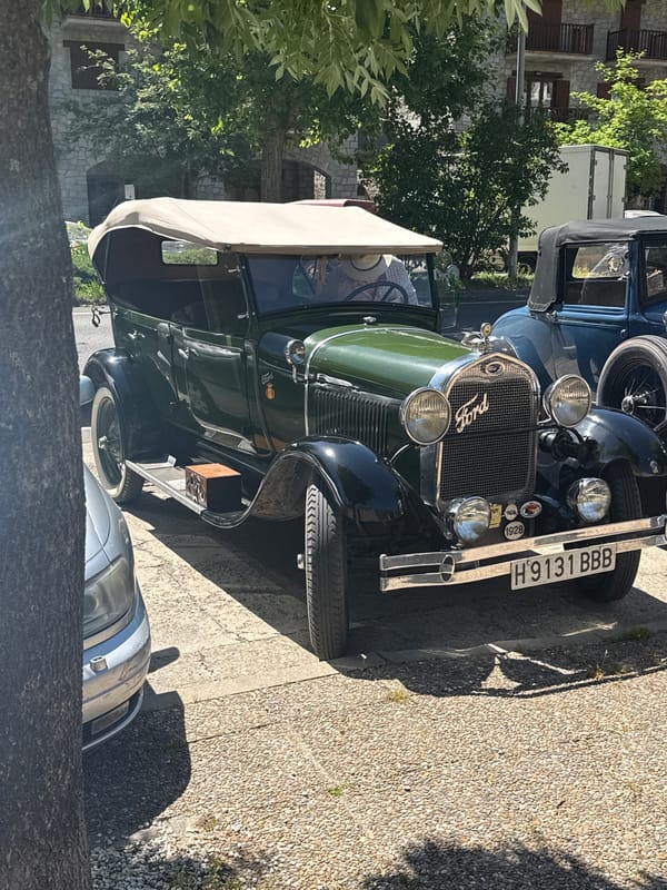 Vintage Ford cars gather on Benasque street