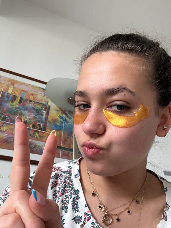 Woman poses with gold star eye patches in Milan