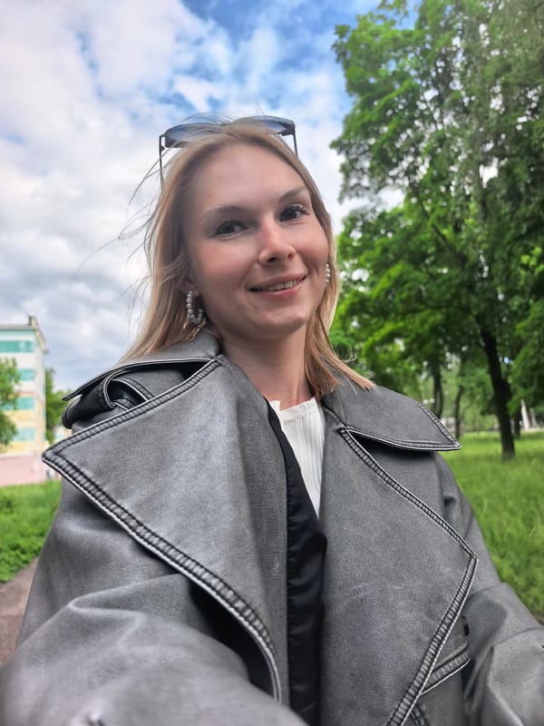 Woman takes selfies in Sterlitamak park wearing leather jacket