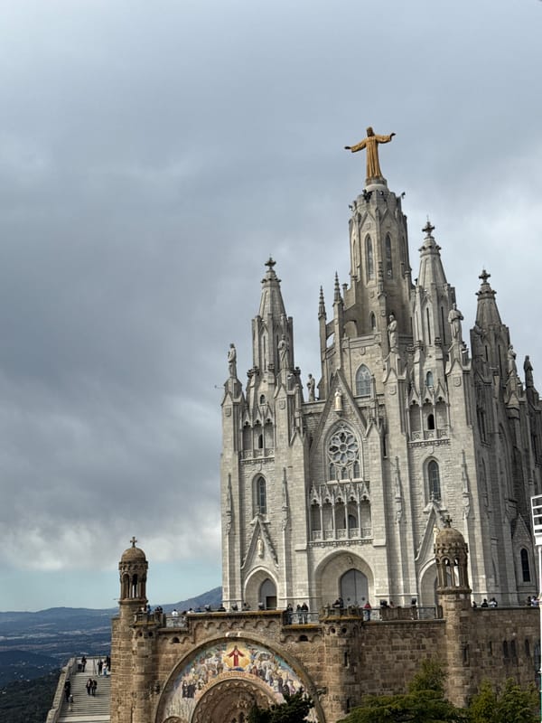 Visitors document rides and views at Barcelona's Tibidabo Amusement Park