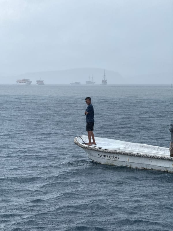 Morning fog shrouds boats off Indonesian coast