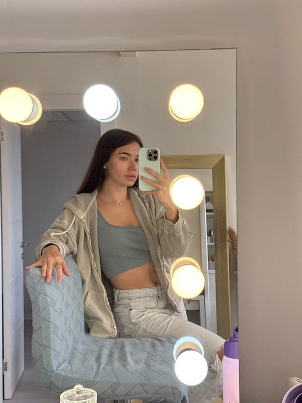 Woman takes mirror selfie in Ramat Gan bathroom
