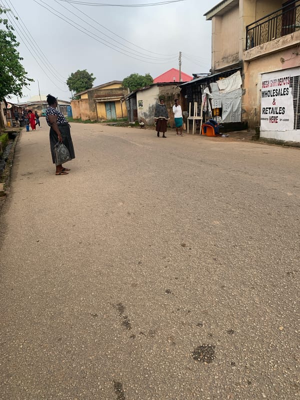 Morning street life in Jos, Nigeria — commuters, kids, and Keke Napeps
