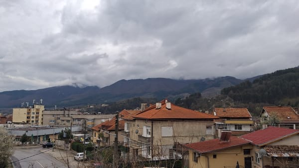 Street view captures red-roofed buildings in Goce Delchev, Bulgaria