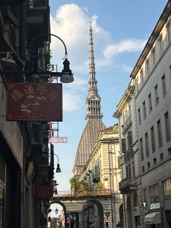 Looking up at Turin's Mole Antonelliana on a clear afternoon