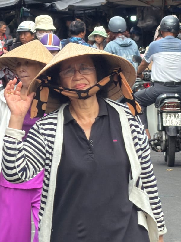 Street market hustle and motorbike traffic in Nha Trang