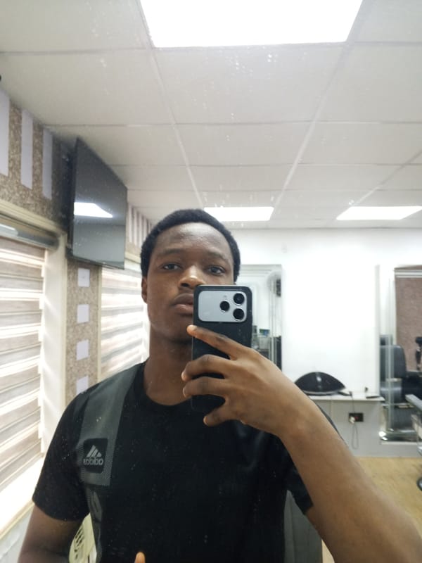 Young man documents barbershop visit in Enugu, Nigeria