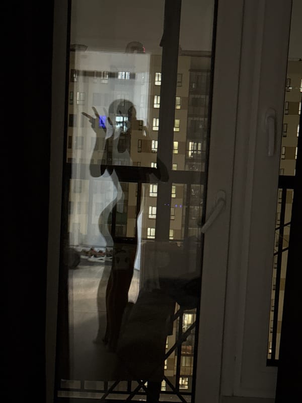 Nighttime window reflections captured in Lyubertsy, Russia