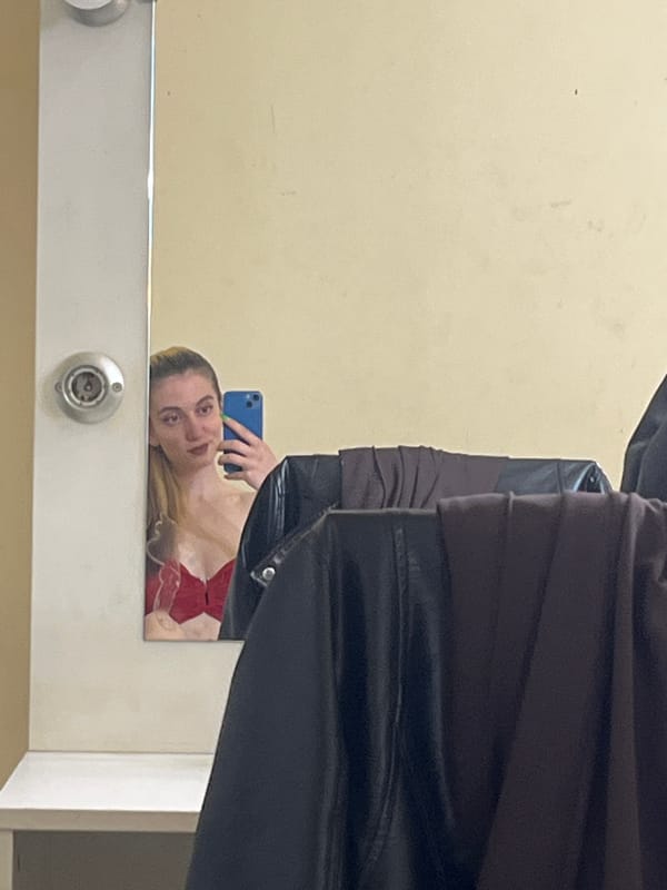 Woman Takes Mirror Selfies with Blue Phone in Plovdiv