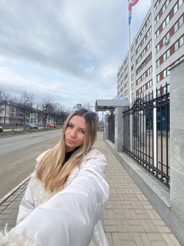 Woman photographed at Chaikovsky district administration building, Russia