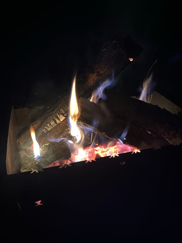 Outdoor fire burns in metal pit in Biysk, Russia