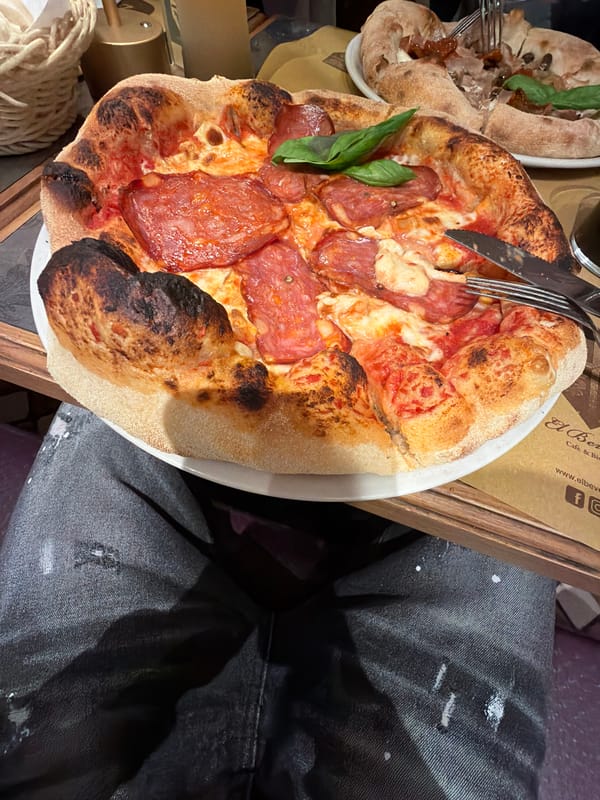 Pizza dinner captured in Milan dining scene