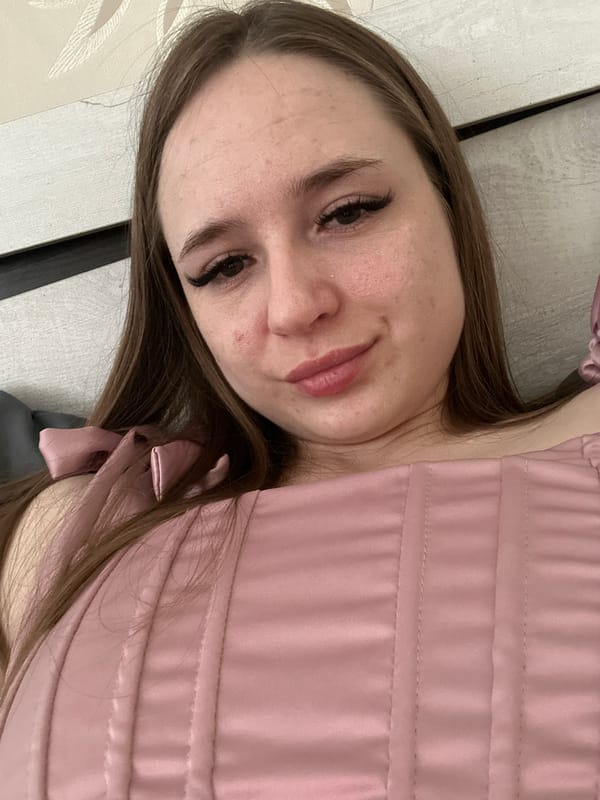 Woman in pink satin photographed resting across multiple angles