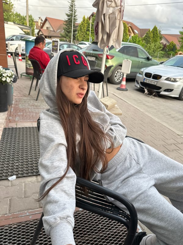 Woman in ICON cap relaxes at Plovdiv cafe