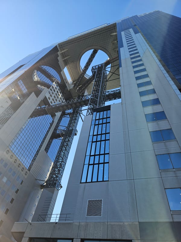 Morning crowds gather at Osaka's iconic Umeda Sky Building