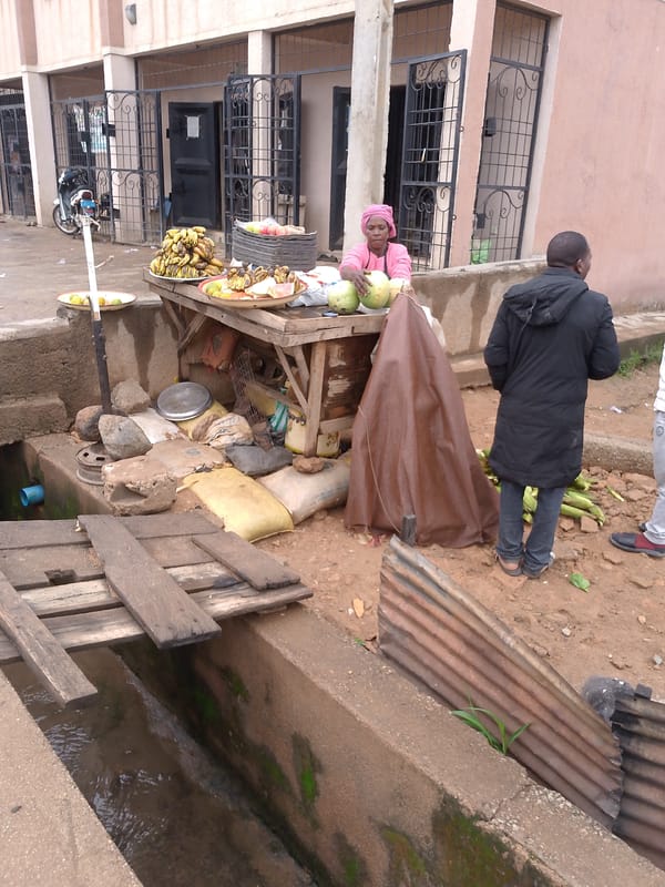 Street vendors operate bustling markets in rainy Bukuru, Nigeria