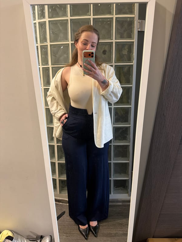 Woman takes mirror selfie with green smartphone in Moscow