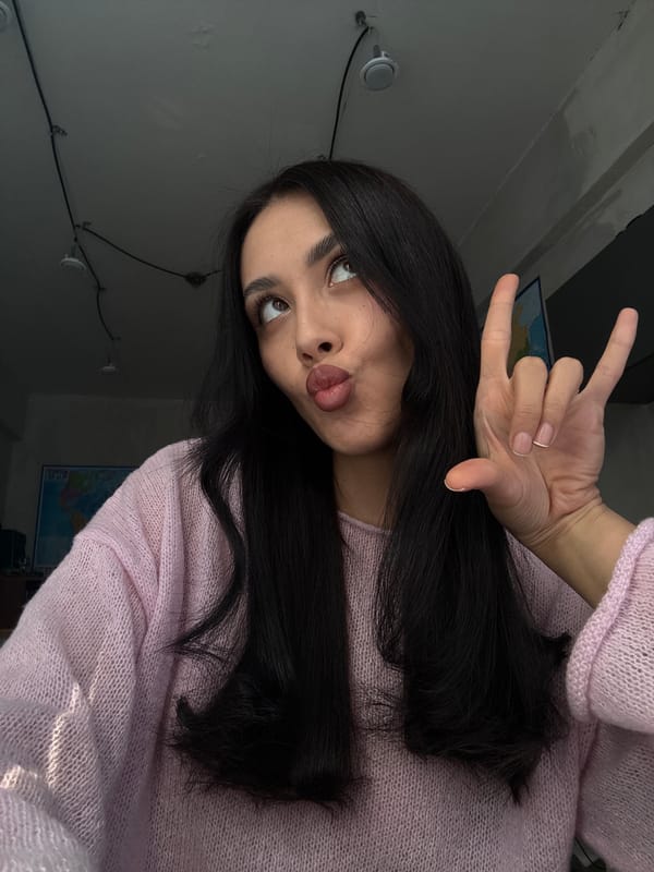 Woman takes selfies in pink sweater in Votkinsk
