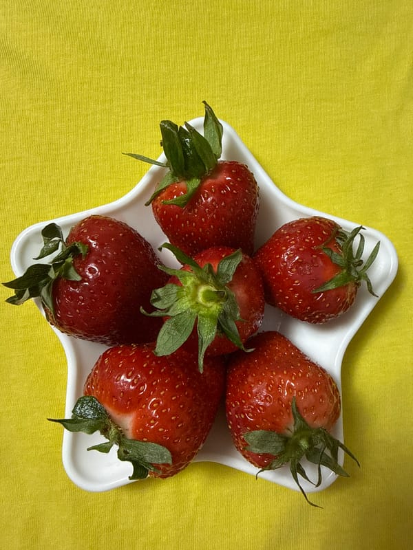 Fresh strawberries photographed in white dishes in Chaikovsky, Russia