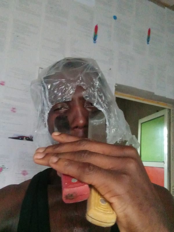 Person documents phone unboxing and daily activities in Akwete