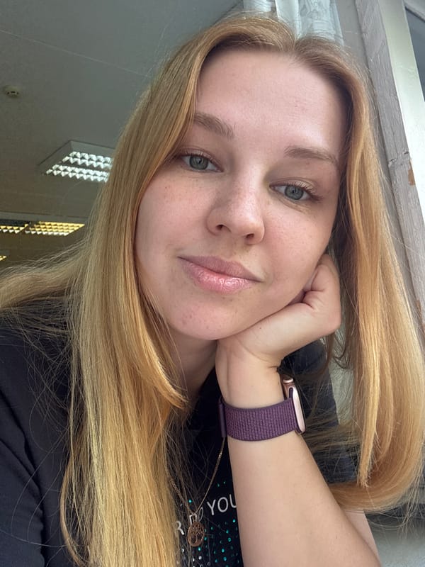 Woman takes selfie under cloudy skies in Rusanovo