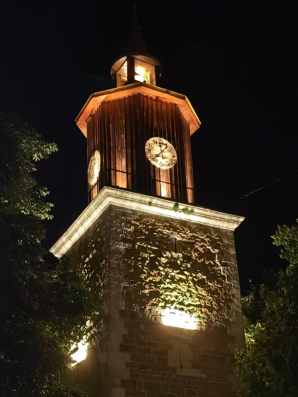 Clock tower illuminated against night sky in Svishtov, Bulgaria
