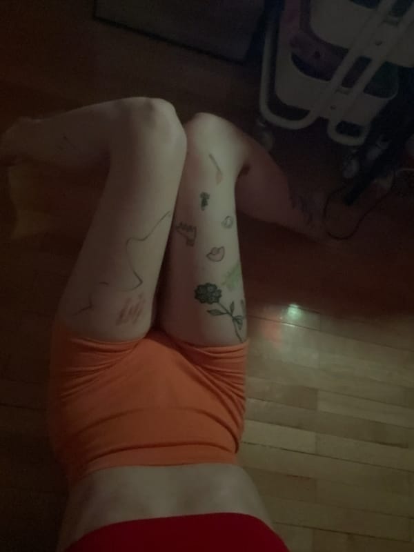 Person resting on wooden floor captured in Belgrade