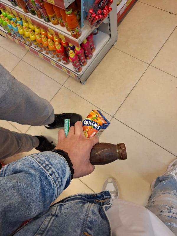 Shopper selects beverages at Veliki Preslav store