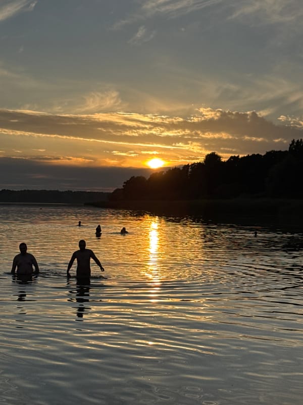 Midsummer evening swim at a Tallinn waterfront sunset