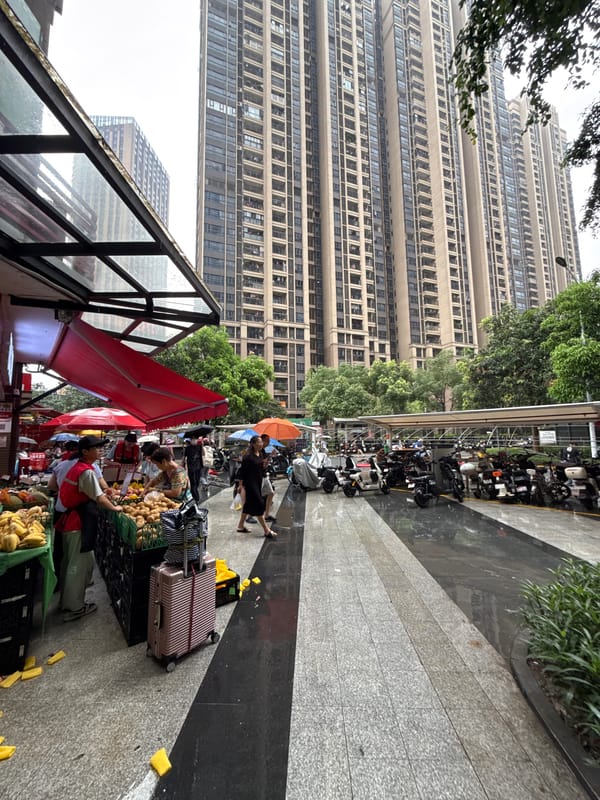 Rainy street market scene in Haizhu District, China
