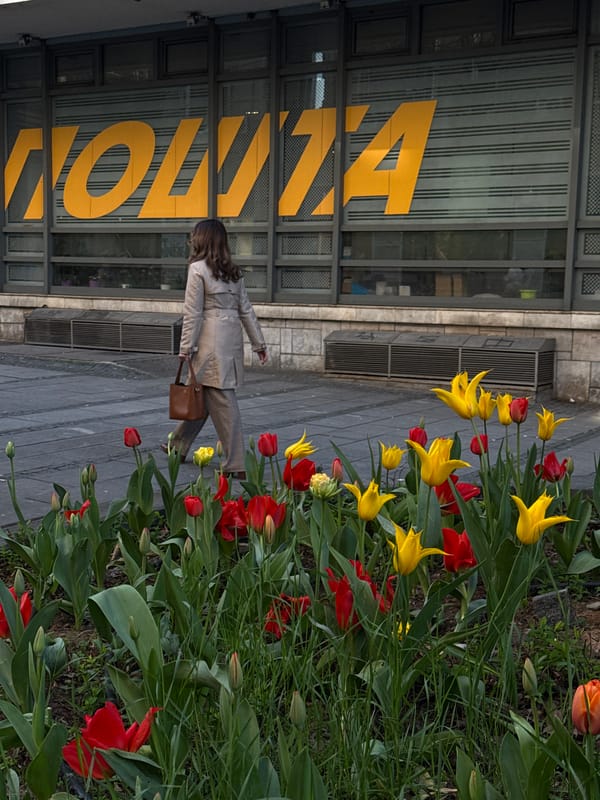 Woman takes selfie near ramen shop in Belgrade