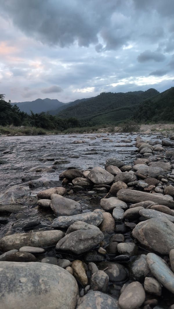 Riverside stones and a quiet porch in Huế