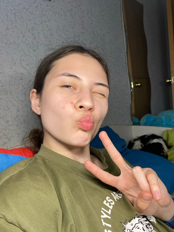 Woman poses playfully during video session in Votkinsk