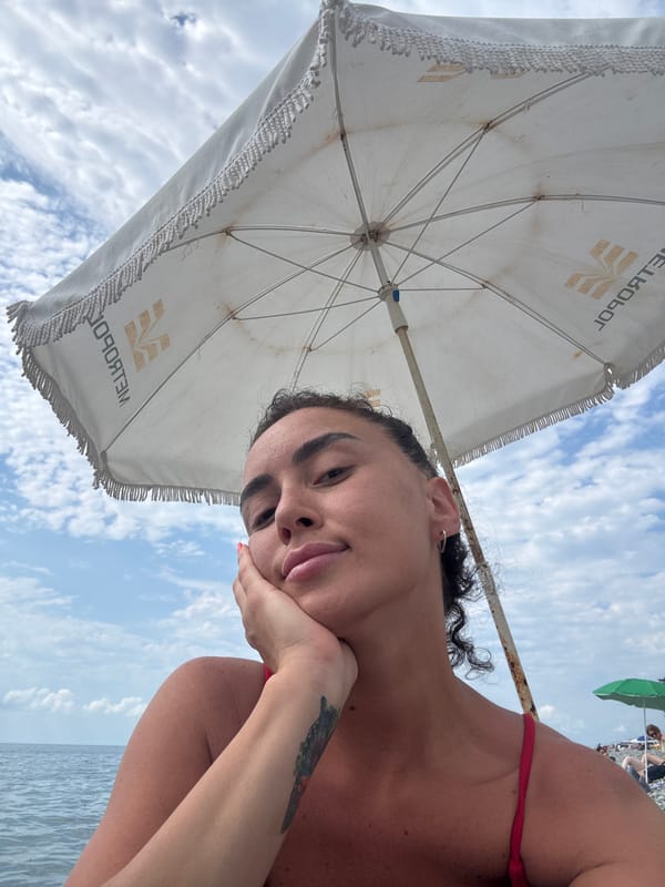 Relaxing on Batumi's pebble beach on a cloudy summer day